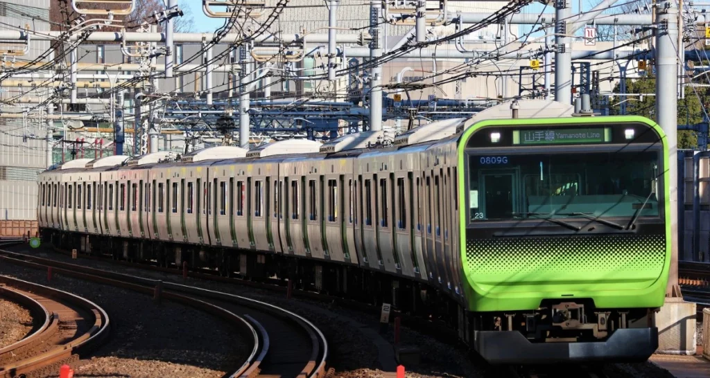 The Yamanote train on tracks in Japan. 
